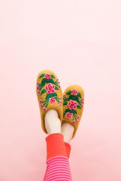 If in between sizes, size up Take your lovely garden inside with you with these elegant Secret Garden Slippers. Inspired by ornate vintage slippers from the 1920s, each one is hand felted and hand embroidered by artisans in Nepal. Featuring intricate and bright floral embroidered designs that pop against the bright wool. 100% wool and leather sole. Sold in sizes XS (6-6.5), S (7-7.5), M (8-8.5), L (9-9.5), XL (10-10.5). We know slippers are bit trickier to fit than our knit hats so we are offeri Vintage Slippers, Felted Wool Slippers, Winter Knit Hats, Wool Slippers, French Knots, Warm Slippers, French Knot, Hand Felted, Felted Wool