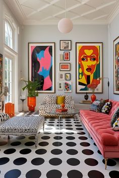 a living room filled with lots of furniture and pictures on the wall above it's colorful couches