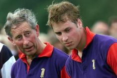 two men standing next to each other in front of a group of people wearing purple and red shirts