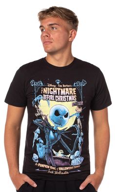 a man wearing a black t - shirt with an alien on it