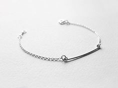 "Ultra skinny bar & sparkling bezel-set CZ stone bracelet set. Handcrafted in sterling silver, they are simple and minimal, delicate yet sturdy. A beautiful and versatile bracelet set - Layer together or wear individually for two totally different looks. Available in clear CZ or Black CZ. Listing is for two bracelets. Made to Order. DETAILS Silver Skinny Bar: 32mm ( 1.25-inch) Length CZ Stone: 4mm * This bracelet set is made of high quality Sterling Silver materials. * Top-quality Cubic Zirc Silver Bar, Dainty Bracelets, Layered Bracelets, Silver Bars, How To Make Notes, Cz Stone, Minimalist Jewelry, Stone Bracelet, Delicate Bracelet