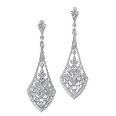 These top-selling Mariell bridal earrings are what make vintage wedding jewelry so popular! They boast a jewel-encrusted flare design rich in cubic zirconia inlaid stones. These dramatic 14 K gold, silver, or rose gold rhodium plated earrings measure 2 3/4" for an eye-catching wedding accessory. These beautiful earrings are great for mothers of the groom, mothers of the bride, and bridesmaids as well. Rich Earrings, Cubic Zirconia Bridal Earrings, Wedding Earrings Chandelier, Silver Bridal Earrings, Vintage Wedding Jewelry, Spanish Wedding, Dangle Earrings Wedding, Dramatic Classic, Earrings Chandelier