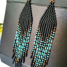 Blue Turquoise ,Matt Black and bronze color combination.Long tassel earrings. Beaded earrings. native American style .Fringe earrings .Seed Bead Earrings .Boho earrings . Materials;Sterling silver ear wire. High quality japanese beads 3 shades. This bead does not lose its color and does not darken. Earrings length 4.5 inches (11cm) You can see a large selection of earrings on my page https://www.etsy.com/il-en/shop/JewelryByElenaZar?ref=seller-platform-mcnav§ion_id=25458740 Black Tassel Earrings With Colorful Beads For Gift, Bohemian Tassel Earrings With Black Beads For Gift, Bohemian Black Beaded Tassel Earrings Gift, Black Bohemian Long Drop Beaded Earrings, Black Bohemian Long Drop Earrings, Black Tassel Drop Earrings With Colorful Beads, Bohemian Black Tassel Earrings With Dangling Beads, Black Bohemian Dangle Tassel Earrings, Bohemian Black Tassel Earrings As Gift