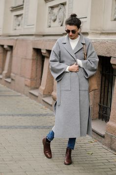 Light gray wool coat is designed with its oversized fit and lowered shoulders line. The notch collar adds a touch of sophistication, while the two patch pockets offer both style and functionality. With two side slits for ease of movement, this coat is as practical as it is stylish. Complete with a belt for, this long oversize wool coat is the perfect addition to your winter wardrobe.  Coat fabric: 100% wool Lining: 100% viscose SIZE All our clothes are made to order, so please allow 5 - 7 busine Grey Coat Outfit, Camel Coat Outfit Classy, Grey Coats, Camel Coat Outfit, Long Grey Coat, Camel Wool Coat, Grey Overcoat, Mode Mantel, Oversized Wool Coat