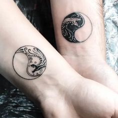 two people with matching tattoos on their arms