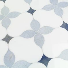 a white and blue tiled floor with circles