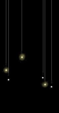 four lights hanging from strings in the dark with one light on top and two below