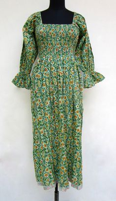 "ITEM DESCRIPTION nature green floral printed cotton long maxi dress - square neckline with smocked maxi dress - long sleeve maxi dress Features: Long sleeve, square neck, Long dress Material: Cotton cambric Fabric: 100% cotton soft light weight ethnic print fabrics  Sleeve Length = 22 inch For more sizes & their measurement, please refer our below chart to understand the sizes variations available with us For your size requirement, please mention your size in seller note at the time of buying. SIZE MEASUREMENT  BUSTLENGTHSHOULDER XXS34 inch51 inch13.5 inch XS36 inch51 inch14 inch S38 inch51 inch14.5 inch M40 inch51 inch15 inch L42 inch51 inch16 inch XL44 inch51 inch16.5 inch 2XL46 inch51 inch17 inch 3XL48 inch51 inch18 inch   Company Return Policy:  Please write for more information to my Square Neck Long Dress, Long Sleeve Boho Maxi Dress, Smocked Maxi Dress, Nature Green, Ethnic Print, Rayon Dress, Dress Out, Smocked Dress, Boho Maxi