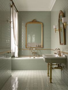 a bath room with a sink a mirror and a bath tub sitting next to each other