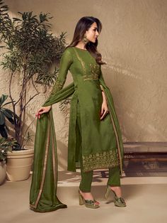 Defined by Malaika Arora's sense of fashion, this mehndi green kurta set is an epitome of grandeur and majestic artwork. Crafted using Zari work and mukaish embroidery, it features a straight top with three-quarter sleeves, a round neck and organza & shantu inner for comfort. The set includes a pair of cotton trousers and an organza dupatta with exquisite floral Zari machine weave yoke/border embroidery and taping. TOP: Organza, TOP INNER: Shantun, BOTTOM: Cotton, DUPATTA: Organza, Dry Clean