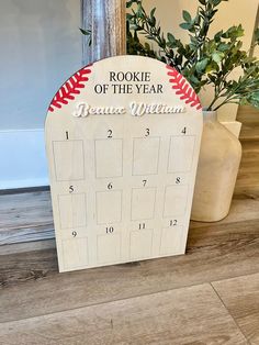 a wooden calendar with a baseball design on it