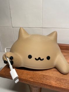 a cat shaped device is sitting on a table