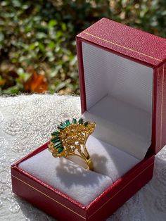 We have a beautiful gold tone vintage emerald green gemstone cocktail style ring. This ring is one of our personal favorites from our collection. We just don't have any room for it anymore! This ring would be perfect for a statement ring or even as a gift!  The ring is secondhand and does have minor markings but still very wearable! Please see attached photos for better description of the ring!  The ring is a size US size 7 1/2 Gold Emerald Open Ring For Wedding, Party Green Emerald Cut Rings, Party Emerald Cut Green Rings, Green Emerald Cut Party Rings, Green Emerald Cut Rings For Party, Gold Open Emerald Ring For Formal Occasions, Formal Gold Emerald Crystal Ring, Vintage Green Crystal Open Ring, Vintage Green Emerald Open Ring