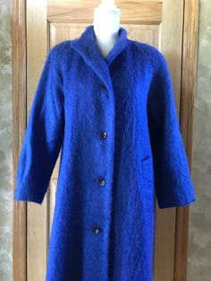 Vintage Vibrant Royal Blue / Shocking Electric Blue Shag 1980's Long Peacoat  by George David Fashions Label: George David Fashions Tag Size: No size Tag Measurements:   recommend you compare to garments you currently wear to determine fit  Measurements taken with the garment lying flat S2S:  19" Bust:  up to 48" Sleeve:  22" Length:  46 1/2" Condition:  Excellent Please review the photos carefully.  We examine each item carefully and do our best to note imperfections.  Please understand that vintage items are not new. All items are pre-loved and sold AS-IS.   Please reach out with any questions; we are here to help. Thank you for looking! Blue Long Wool Coat For Fall, Blue Long Pea Coat For Fall, Blue Sweater Coat For Cold Weather In Fall, Blue Sweater Coat For Cold Fall Weather, Blue Wool Coat With Buttons For Fall, Blue Wool Outerwear For Cold Weather, Blue Outerwear With Button Closure For Cold Weather, Blue Wool Coat With Buttons For Winter, Blue Vintage Outerwear For Fall