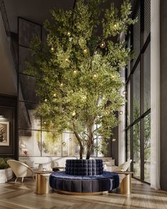 a living room filled with furniture and a tree in the middle of it's center