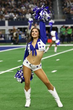 a cheerleader is dancing on the field