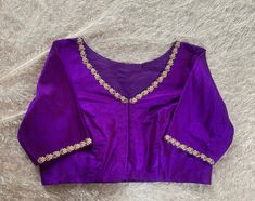 Hand embroidered ready made saree blouse / crop top/stitched saree blouse usa / purple v neck  saree blouse/ hand embroidered blouse/zardosi blouse/v neck  saree blouse/ purple pure silk blouse/ maggam work blouse        It is very true that a perfect blouse is the one which makes your saree look stand out !! If you find one of such a style that you have been wanting to have then dont let it go !! we carry such unique trending blouses that instantly add a stylish look to any saree !!     Well..!! we understand that you may not get in your desired size/pattern, here you go with customization according to your size/pattern which we can deliver in 1-2 weeks of time period !!      Here is a beautiful Hand embroidered saree blouse in pirple color that has simple yet unique embroidery on necks a Luxury Purple Blouse Piece With Embroidered Border, Affordable V-neck Blouse With Zari Work, Luxury Purple Blouse Piece With Traditional Patterns, Luxury Purple Blouse Piece With Dori Work, Luxury Purple Blouse Piece For Puja, Luxury Purple Blouse With Dupatta, Luxury Embellished Purple Blouse Piece, Affordable Purple Blouse Piece For Diwali, Luxury Purple Blouse For Diwali