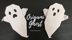 origami ghost made out of paper on a black surface with the words organic ghost written in white