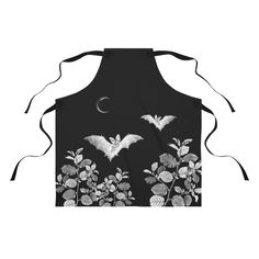 an apron with bats and flowers on it