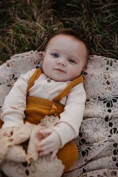 6 month old infant sitting on a crochet blanket at a state park wearing rust colored overalls 2 Month Old Photo Shoot Outside, 6 Month Baby Picture Ideas Boy Fall, 6 Month Old Fall Pictures, 6 Month Milestone Pictures Outdoor, 6 Months Baby Photoshoot Ideas Outdoor, 2 Month Old Photo Shoot Posing Ideas, 3 Month Old Photoshoot Ideas