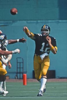 a football player throwing a ball during a game