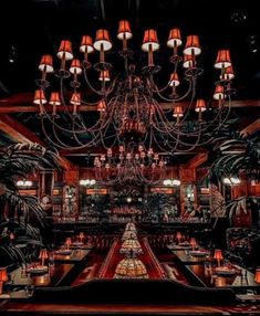 a chandelier hangs from the ceiling in a restaurant