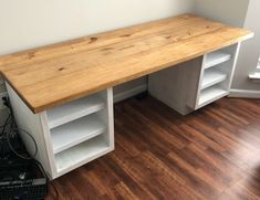 a wooden desk sitting on top of a hard wood floor