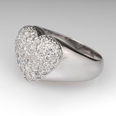 This lovely diamond ring features a heart design and accented with fifty-three (53), bead set, round brilliant cut diamonds. The ring measures 14.0mm at the top, rises 6.5mm above the finger, tapering to 4.2mm wide and 1.2mm thick at the base of the shank. The ring is currently a size 8. Luxury Heart Ring With Single Cut Diamonds For Wedding, Luxury Heart Shaped Diamond Ring For Formal Occasions, Luxury Heart Cut Brilliant Ring, Luxury Heart Ring With Diamond Accents For Wedding, Luxury Heart Shaped Ring For Formal Occasions, Elegant Platinum Heart Ring, Luxury Heart Cut Ring With Brilliant Cut, Luxury Cubic Zirconia Heart Ring For Anniversary, Heart Shaped Diamond Ring With Accents For Proposal