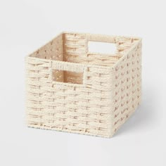 an empty basket with handles on a white background