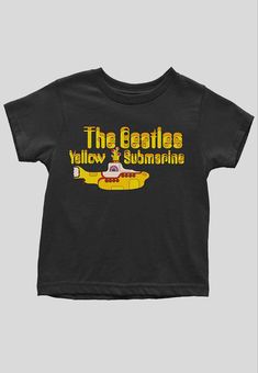 Must Have item for any Little Rocker! An officially licensed Tee featuring the The Beatles 'Yellow Submarine Logo & Sub' design motif. Soft-style cotton toddler's tee featuring short sleeves and crew neck collar from 12 months through 5 years old. This high quality Tee is available in a black colourway. Beatles Yellow, Yellow Submarine