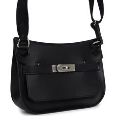 This Jypsiere mini is in Black evercolor leather with palladium hardware and has tonal stitching, a single flap, two pull straps, turnlock closure, and an adjustable wooly shoulder strap.The interior is lined with Black lambskin and has one open pocket on the front wall.Collection: WOrigin: FranceCondition: New and never worn (plastic on hardware) - A few light scuffs due to storage.Accompanied by: Hermes box, Hermes dustbag, shoulder strap, felt, carebook, ribbonMeasurements: 9" width x 7" heig Classic Black Shoulder Bag With Palladium Hardware, Black Calf Leather Shoulder Bag With Palladium Hardware, Calf Leather Bag With Hasp Closure For Everyday Use, Evening Bag In Epsom Leather With Metal Hardware, Evening Bags With Turn-lock Closure In Epsom Leather, Evening Bags With Epsom Leather And Turn-lock Closure, Business Bags In Calf Leather With Hasp Closure, Hermes Jypsiere, Hermes Birkin 25