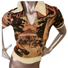 *Chia Bin  Strut cycle All Over Print V-Neck Collar T Shirt short sleeve One of a kind print  Circa 60s/70s. LABEL: Unbranded SIZE: Extra Small Slim Fit  MEASUREMENTS:   • Underarm: 15.5” • Waist: 10” stretches form fitting • measured from collar Sleeve: 7” • Shoulder-14” • Length: 20” COLOR: Multicolor   MATERIAL: 100% Cotton.  CONDITION: Deadstock, no flaws.  Care: Hand wash cold, hang to dry or dry flat. Press as needed with a warm iron.  Please remember that all vintage items are at least 20 Designer V-neck Summer Tops, Designer Graphic Print Blouse For Summer, Designer Summer Blouse With Graphic Print, Designer Blouse With Graphic Print For Summer, Designer Printed Tops For Summer, Designer Printed Summer Tops, Summer Polo Collar Top With Graphic Print, Graphic Print Polo Collar Top For Summer, Summer Graphic Print Top With Polo Collar