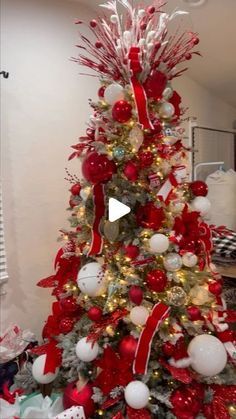 a christmas tree decorated with red and white ornaments