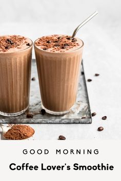 two glasses filled with coffee lover's smoothie on top of a metal tray