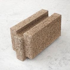 a stone bench sitting on top of a white floor