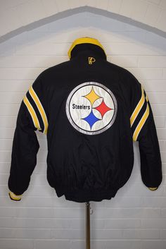 "Vintage Pittsburgh Steelers NFL Pro Player Reversible Puffer Jacket 90's Medium Measured Size   Under Arm to Under Arm 24\" Top to Bottom 29\" Shoulder Seam to Cuff 24\" Excellent condition. Very minimal discoloration/fading   We sell 'As Is\" final sale. We extensively look over every garment that we post on Etsy. However, things do get missed. While we want our clients to love each piece as much as we do some things won't be up to some standards. We ask that you keep in mind that these are vi 90s Winter Sports Outerwear, 90s Winter Outerwear For Sports Events, Reversible Puffer Jacket, Vintage Pittsburgh, Pittsburgh Steelers, Puffer Jacket, Pittsburgh, Final Sale, Nfl