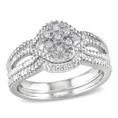 Pledge your love with this darling diamond bridal set. Expertly crafted in sleek sterling silver, the eye is drawn to the flower-shaped cluster of shimmering round diamonds at the center of the style. Polished and beaded ribbons sweep and swirl around the center cluster, wrapping it in a sparkling embrace and creating the ring's triple shank. A coordinating beaded band completes the ensemble. A look of purest love and affection, this set captivates with 1/8 ct. t.w. of diamonds and a polished sh Diamond Bridal Ring Sets, Sterling Silver Rings Set, Gorgeous Ring, Silver Ring Set, Diamond Bridal Sets, Diamond Ring Settings, Diamond Engagement Ring Set, Silver Wedding Rings, Split Shank