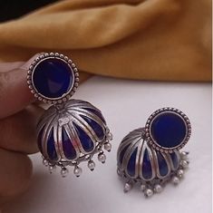 Navy Blue Jhumka/ Blue Meenakari Jhumka/ Oxidized Silver Jhumka Earrings/Blue Tribal Jhumka/ Designer Earrings/ Indian Ethnic Earrings Description: - Length: 2 Inches - Earring come with Push back Closure - Lightweight Meenakari Jhumka Earrings - Contemporary earrings in silver finish. - Very Elegant and stylish, these earrings can be paired with any traditional Indian or Western Attire depending upon the occasion and the theme. - The base is pure brass which makes this very sturdy and of good q Cheap Bohemian Jhumkas For Diwali, Blue Fusion Earrings With Latkans, Blue Temple Jewelry Jhumkas For Celebration, Festive Blue Tilla Jhumkas, Temple Style Blue Jhumkas For Celebration, Blue Temple Jewelry Earrings With Latkans, Blue Temple Jewelry Jhumkas Gift, Blue Temple Jewelry Earrings For Festive Occasions, Blue Tilla Jhumkas For Gift