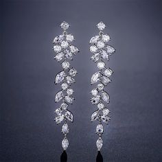 Elegant and Sparkly Chandelier Earrings - Perfect for Weddings, Proms, or any outing. Includes:♥ 1 pair of earrings ♥ 1 Free Gift BoxProduct Details:Dimensions♥ Length: 60 mm / 2-5/8 inches♥ Width: 11 mm / 3/16 inchColor♥ Cubic Zircon: Clear♥ Base Metal: Silver ColorMaterial♥ AAA Cubic Zircon♥ White Gold Plated Copper Alloy Wedding Earrings Chandelier, Silver Bridal Earrings, Bridal Earrings Chandelier, Dangle Earrings Wedding, Engagement Earrings, Bridal Earrings Drop, Prom Jewelry, Wedding Accessories Jewelry, Long Drop Earrings