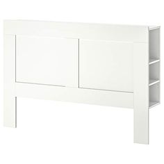 a white headboard with two open shelves