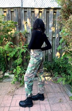 "These Camouflage cotton military pants are marked 1996 and feature a concealed button fly and button cargo flapped hip pockets. 2 slide in front pockets at front. There are stitched air hole vents in the crotch. Nicely broken in with lots of years of wear ahead. Fits like Men's M or Women's M/L/XL or Oversized but please see measurements below for an accurate fit. M E A S U R E M E N T S Waist: 33\" Inseam: 31\" Rise: 12\" Hips: 38\" condition: Good vintage condition. One of the cuff laces is m Lee Dungarees, Beige Cargo, Army Pants, Military Pants, Fall Pants, Preppy Fall, Dungaree Jeans, Brown And Beige, Red Tartan