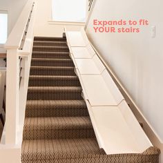 an escalator with stairs leading up to the top floor and bottom stair treads