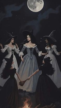 three women dressed up as witches in front of a full moon