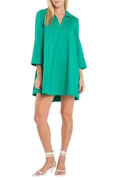 This crisp cotton-blend dress is designed in an A-line silhouette with a polished collar. Slips on over head Spread collar Split neck Bracelet-length sleeves Side-seam pockets Cotton lining 65% cotton, 32% nylon, 3% spandex Hand wash, dry flat Imported Green Tunic For Daywear, Cotton Mini Dress With 3/4 Sleeves, Relaxed Fit Split Neck Dress, Neck Bracelet, English Factory, Cotton Blends Dress, Perfume Gift Sets, Caftan Dress, Beauty Services