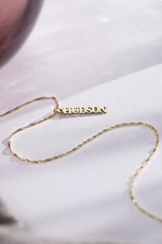 Make a statement with our Vertical Name Necklace, tailored to showcase your unique identity. Perfect for adding a touch of personal charm to any look. #NameNecklace #PersonalizedJewelry #SignatureStyle #thecustomgoodsco #customjewelry #jewelry #handmadejewelry #finejewelry Wedding Nameplate Jewelry With Adjustable Chain, Anniversary Name Necklace With Adjustable Chain For Valentine's Day, Anniversary Name Necklace With Adjustable Chain, Meaningful Jewelry With Adjustable Chain As A Gift, Customizable White Gold Jewelry For Gift, White Gold Jewelry With Name For Gift, Yellow Gold Necklace For Father's Day Gift, Yellow Gold Jewelry With Adjustable Chain For Mother's Day, White Gold Personalized Jewelry Gift