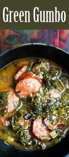 green gumbo soup in a black bowl with spinach and sausage on the side