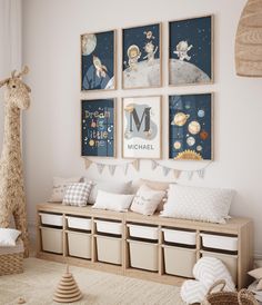 a child's room decorated in neutral colors with toys and posters on the wall