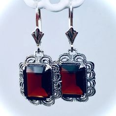 These are Victorian reproduction earrings in sterling silver set with stunning Natural wine red garnet gemstones. Each festoon earring is 28mm x 13mm in dimension with post-backs. The earrings are 1 and 1/4 inches long with lever-backs (28mm long). Each gemstone is 10mm x 8mm and are 3.8ct each. The earrings closures are a choice of ear wires, deco-posts, or lever-backs. Most popular for this earring are the posts-backs and the lever-back style for comfortable wear, and to prevent loss. Victorian Filigree, Silver Shorts, Natural Wine, Garnet Earrings, Garnet Gemstone, Red Garnet, Fall Leaves, Wine Red, Deep Red