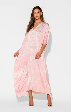 This damask print is a lovely combination of pale pink and white in our Romantique long caftan. The long, flowing caftan is made out of our signature Polysilk fabric for that all-day luxe vibe. Cover-up? Sure. Loungewear? Why not? Brunch with friends? Definitely. Sleepwear? Absolutely. Printed long caftan Lusciously soft poly silk Lightweight and breathable Machine washable for easy care Elegant Spring Kaftan For Loungewear, Elegant Maxi Length Daywear Kaftan, Elegant White Kaftan For Daywear, Elegant Long Kaftan For Loungewear, Elegant Maxi Length Kaftan For Loungewear, Elegant Pink Spring Kaftan, Elegant Pink Kaftan With Kimono Sleeves, Elegant Long Pink Kaftan, Elegant Pink V-neck Kaftan