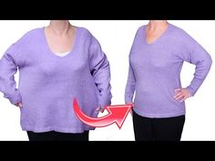 the woman is wearing a purple sweater with an arrow in front of her chest and back